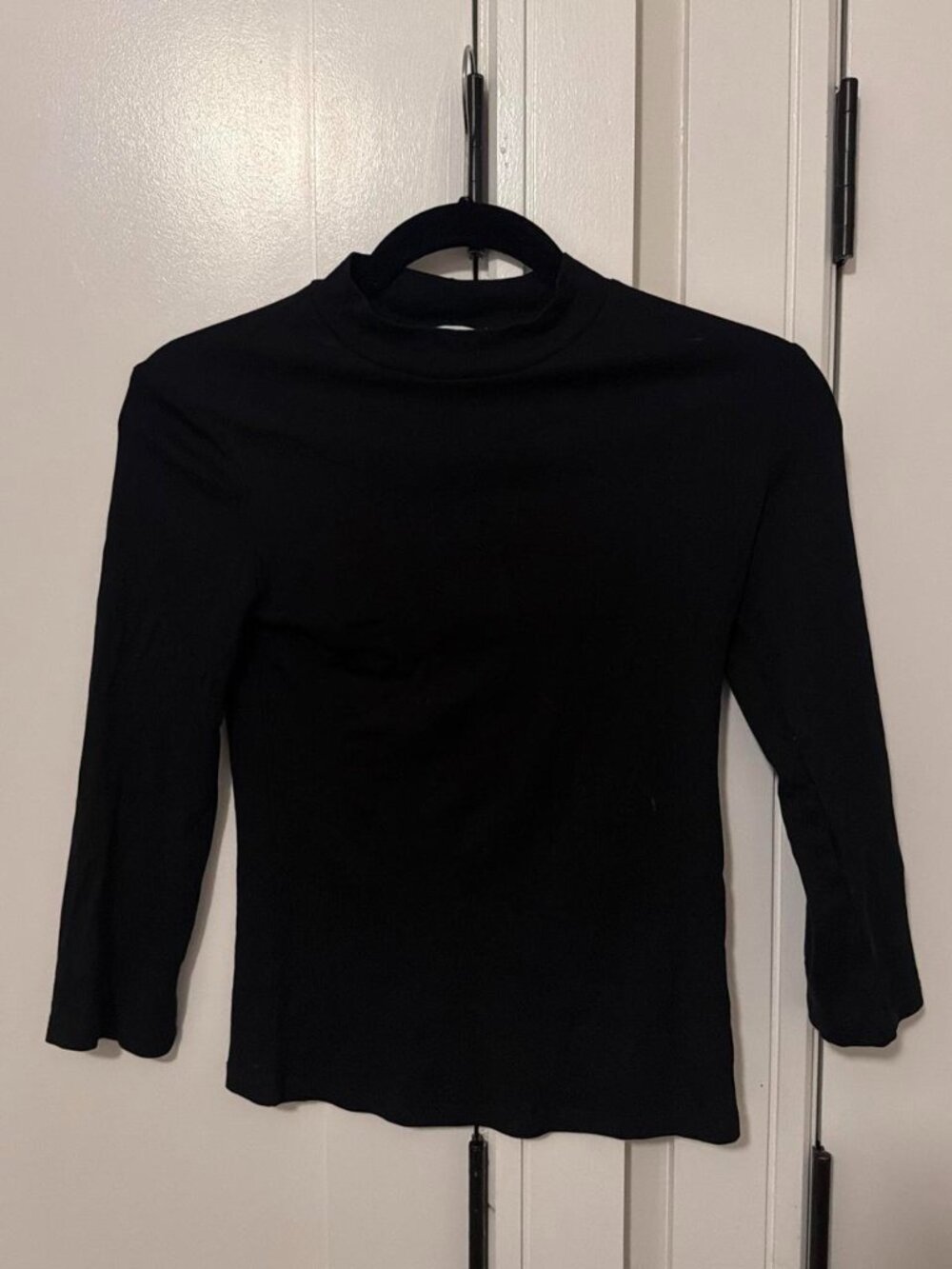 Black mock neck long sleeve top